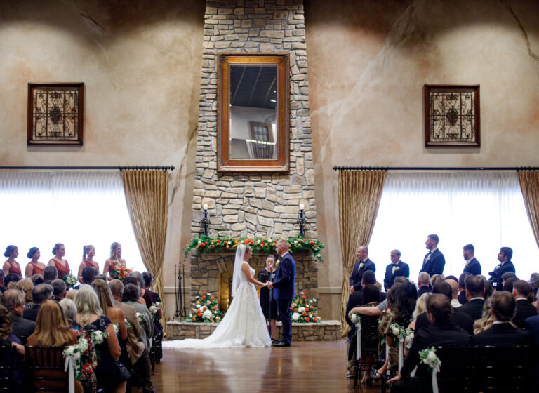 Fall wedding ceremony at the grand fireplace