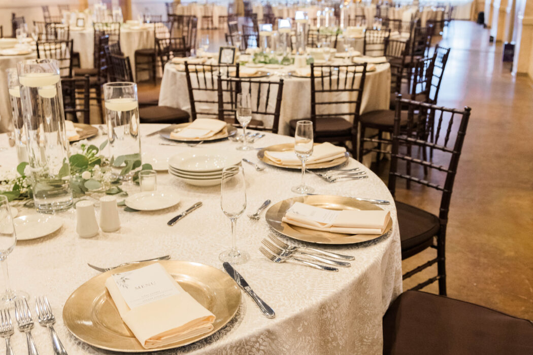 Wedding table setting with specialty linens in the Grand Room