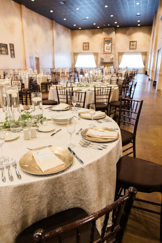 Wedding table setting with specialty linens in the Grand Room